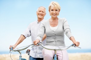 Couple enjoying biking together while being free from Osteoporosis