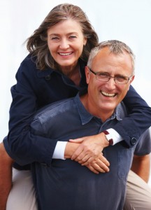 A couple both smiling at the camera who just had a Hip Replacement Surgery