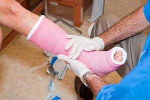 Human's Foot with a fracture being treated by a surgeon