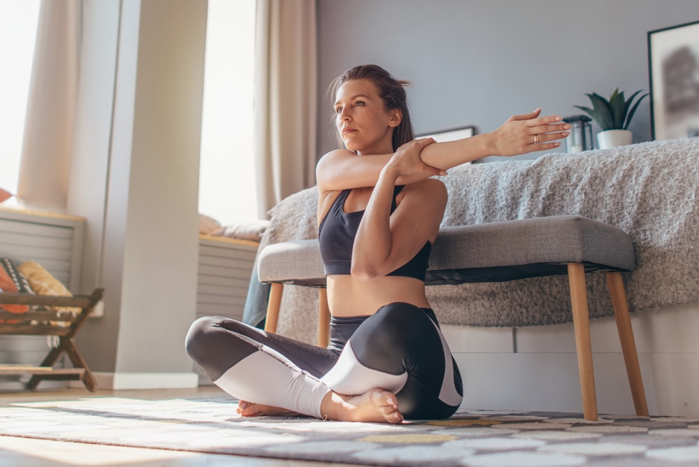 Cross body,Shoulder,Stretch.,Woman,At,Home,Does,A,Warm,Up