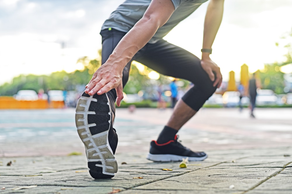 Close,Up,Young,Sport,Man,Is,Stretching,Leg,Muscle,To